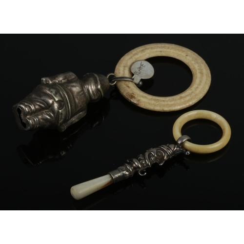 473 - Two antique baby teething rings, comprising a sterling silver jester with a mother-of-pearl handle (... 