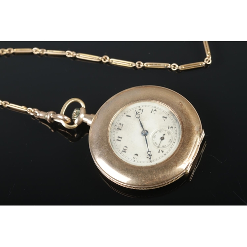 477 - A 9ct gold Swiss made pocket watch with 9ct gold albert chain. Case diameter 45mm.

Chain 9.4g
Watch... 