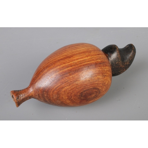 279 - A mid-century vintage hand-carved wooden fruit bowl containing eight pieces, bowl size 32x22cm.