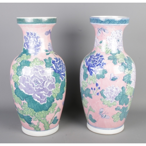 289 - A pair of large vintage blue & pink oriental vases, with delicate botanical painting, height 46cm.