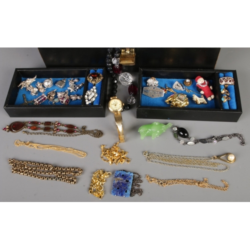 340 - A vintage music box jewellery box containing costume jewellery, including rings, earrings, brooches,... 