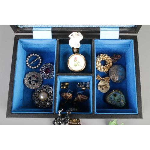 340 - A vintage music box jewellery box containing costume jewellery, including rings, earrings, brooches,... 