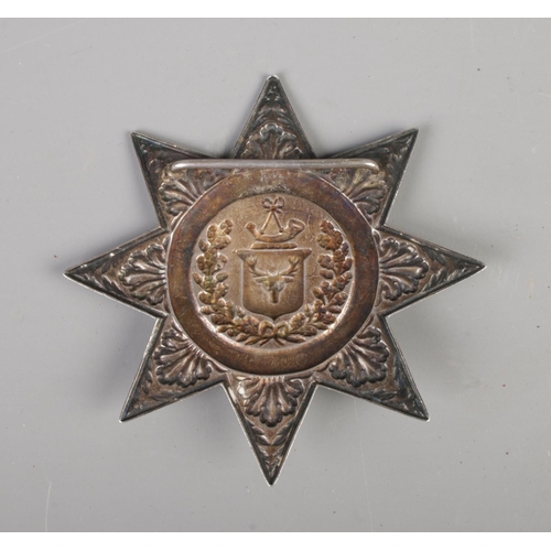 475 - A Victorian silver Ancient Order of Foresters sash badge, having foliage and wreath relief design wi... 