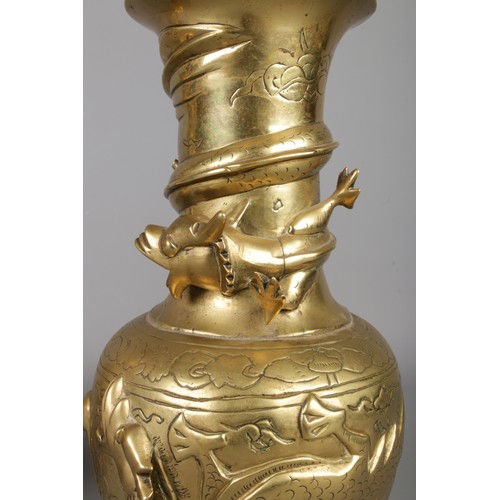 266 - A pair of early Twentieth Century Chinese polished brass vases decorated with coiled dragons. Bearin... 