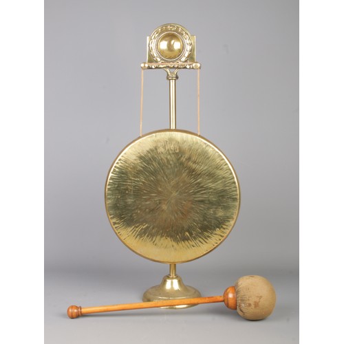 269 - A ornate brass gong with hammer. (54cm)