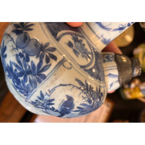 5 - An antique Chinese Kendi decorated in underglaze blue with metal mount to spout. Height 20cm.