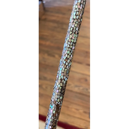 51 - A ladies abalone set walking cane with bone pommel and white metal mounts. Length 87cm.