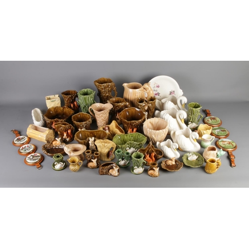 11 - A very large quantity of Sylvac Pottery including swans, woodland creatures, vases etc including mod... 