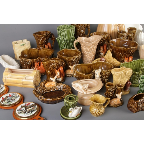 11 - A very large quantity of Sylvac Pottery including swans, woodland creatures, vases etc including mod... 