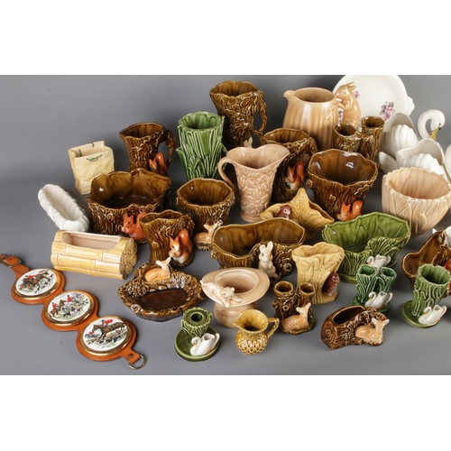 11 - A very large quantity of Sylvac Pottery including swans, woodland creatures, vases etc including mod... 