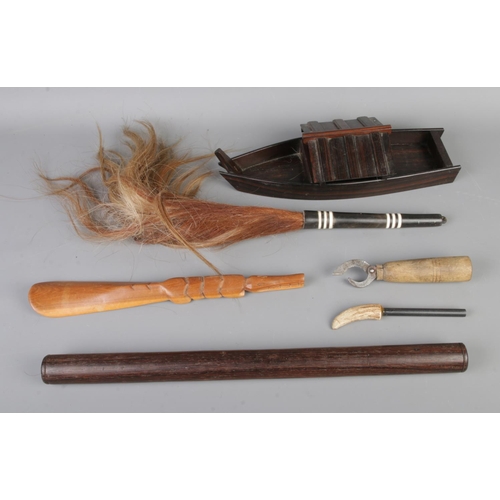 120 - A small collection of woodenwares to include carved crocodile show horn, boat, horse hair fly whip f... 