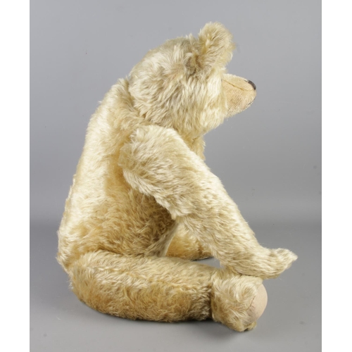 2 - An early 20th century Farnell mohair jointed bear. With growler. Seated height 43cm.
