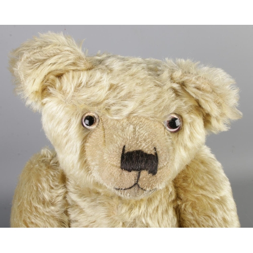 2 - An early 20th century Farnell mohair jointed bear. With growler. Seated height 43cm.
