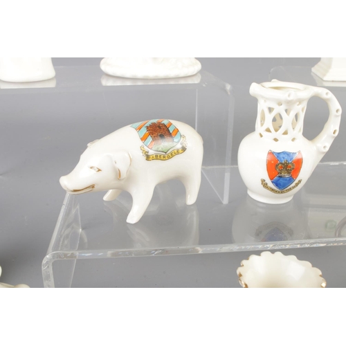 21 - A large collection of Crested Ware, to include Victoria China, Crafton China, Botolph China, Arcadia... 