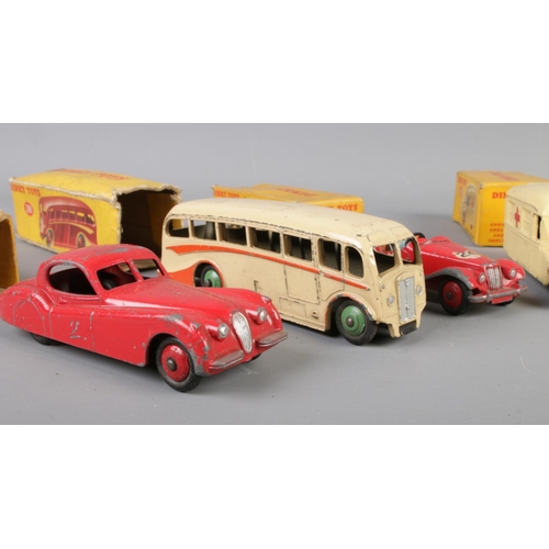 26 - A collection of mostly boxed Dinky die-cast vehicles. To include No. 281 Luxury Coach, No. 108 Midge... 