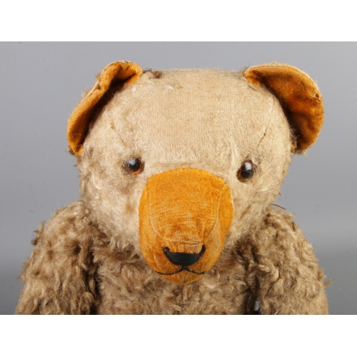 3 - An early to mid 20th century jointed bear, possibly Hermann. Seated height 34cm.
