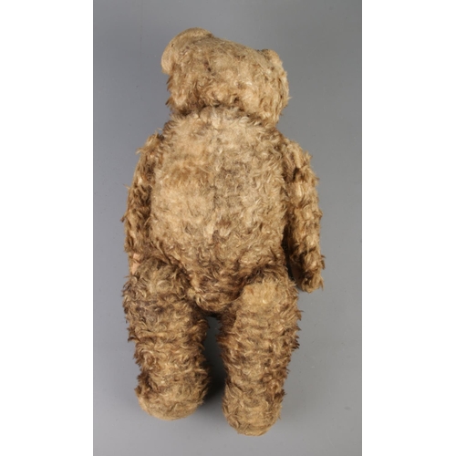 3 - An early to mid 20th century jointed bear, possibly Hermann. Seated height 34cm.