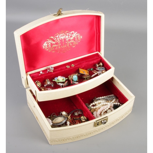 38 - A jewellery box with contents of costume jewellery. Includes rings, earrings, cufflinks, necklaces e... 