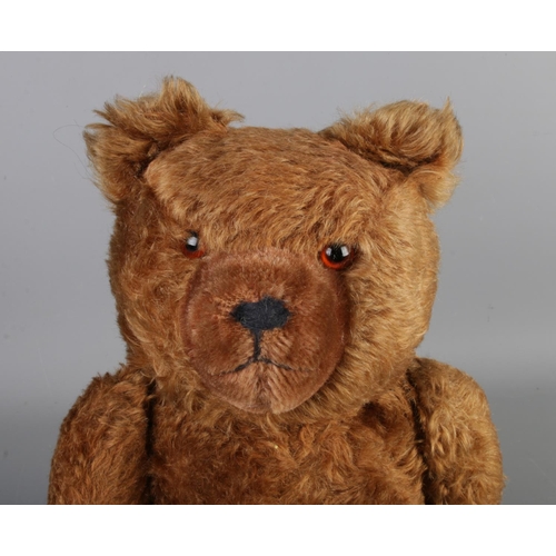 4 - An early to mid 20th century jointed bear, possibly Hermann. Seated height 33cm.