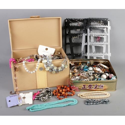 40 - A very large collection of costume jewellery, including a jewellery box full of necklaces, bracelets... 