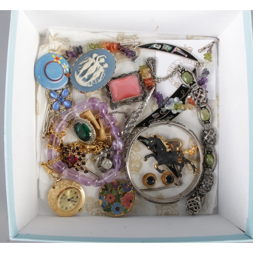 43 - A box of costume jewellery. Includes Ingersoll mechanical watch fob, Celtic style jewellery, brooche... 