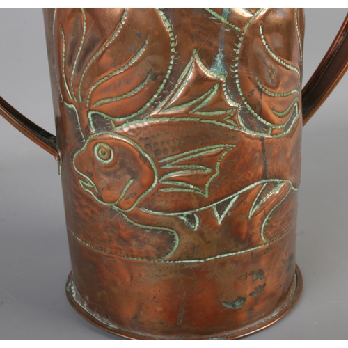 5 - A Newlyn arts and crafts copper twin handled vase featuring hammered fish amongst reeds. Approx. hei... 