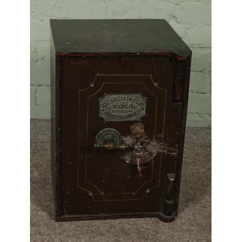 377 - A vintage Jacob Cartwright, West Bromich cast iron safe with key. Approx. external dimensions 36cm x... 