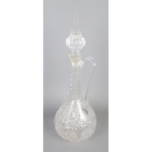 8 - A Victorian cut glass claret decanter (H40cm) with a pair of Victorian engraved decanters (H22cm) .
