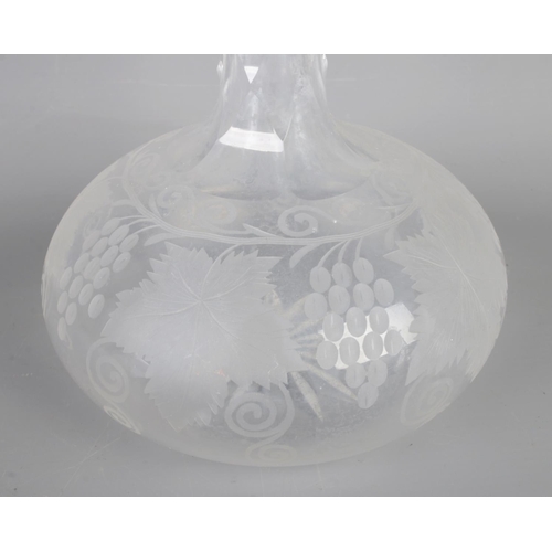 8 - A Victorian cut glass claret decanter (H40cm) with a pair of Victorian engraved decanters (H22cm) .