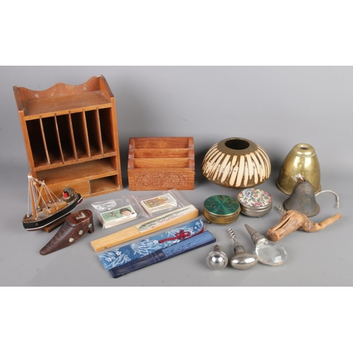 A quantity of collectables, to include carved letter rack, bell, ship ...