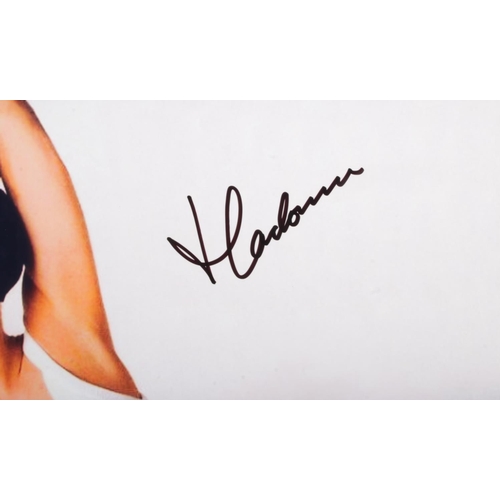 29 - A Madonna signed colour promotional photograph with Certificate of Authenticity. Approx. dimensions ... 