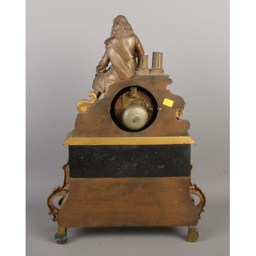 13 - An antique French bronze and slate mantel clock, with a bronze figure seated beside pillars and scro... 