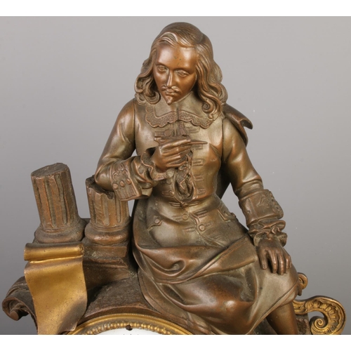 13 - An antique French bronze and slate mantel clock, with a bronze figure seated beside pillars and scro... 