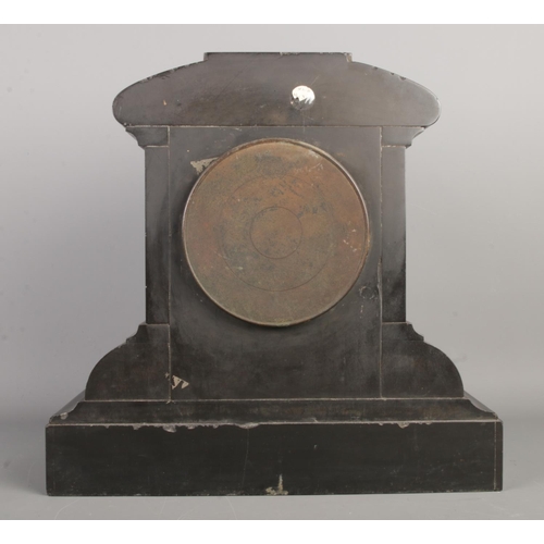 24 - An antique French black slate mantel clock, featuring a V12 visible escapement and gilt-edge dial wi... 