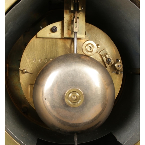 24 - An antique French black slate mantel clock, featuring a V12 visible escapement and gilt-edge dial wi... 