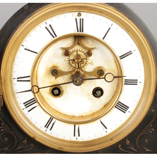 35 - A late 19th century black slate mantel clock with barometer, featuring a visible escapement within a... 