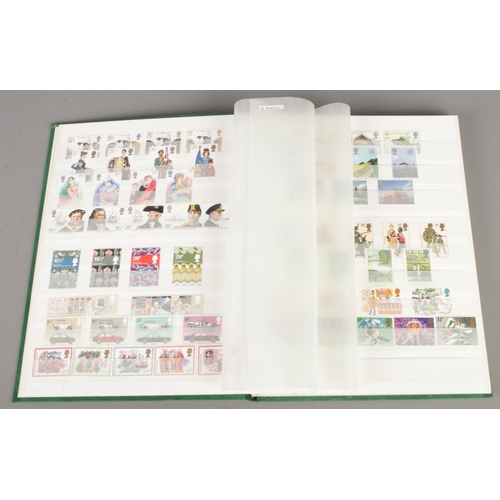 41 - A collection of three stamp albums, including one album containing mint stamps from 1980 to 2000 and... 
