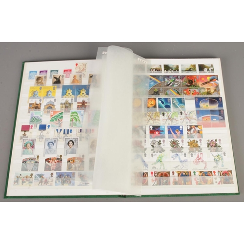 41 - A collection of three stamp albums, including one album containing mint stamps from 1980 to 2000 and... 