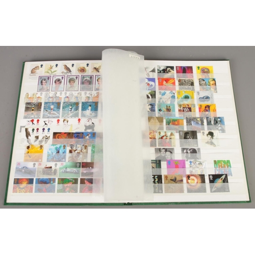 41 - A collection of three stamp albums, including one album containing mint stamps from 1980 to 2000 and... 