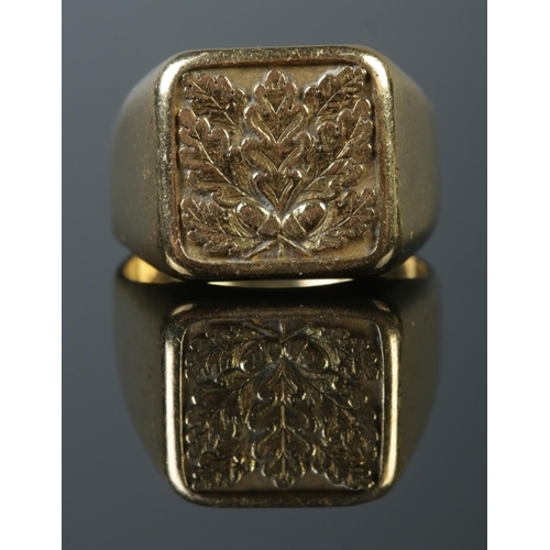 A large 18ct gold signet ring with panel depicting acanthus leaves and ...