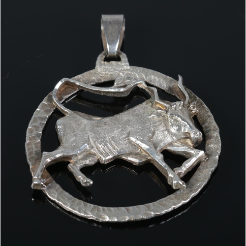 159 - A silver pendant modelled as a bull/Taurus. 5cm x 5cm. 19.29g.
