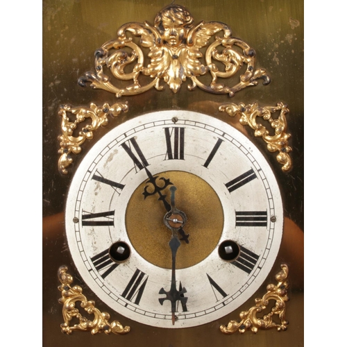 34 - An antique German Junghans carved oak mantel clock, featuring deep relief carvings, circular finial ... 