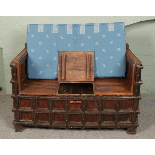 508 - An Indian iron bound box settle/bench with storage compartment under seat.

Hx93cm
Wx140cm
Dx77