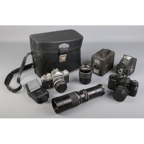 A collection of assorted cameras and accessories including CM-3 Chinon ...