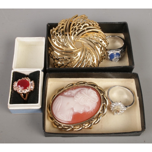 28 - A collection comprising two white metal skull rings, vintage British coins and costume jewellery inc... 
