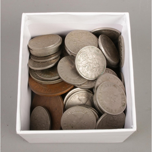 28 - A collection comprising two white metal skull rings, vintage British coins and costume jewellery inc... 