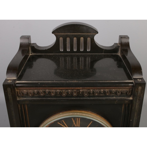 30 - A French antique black slate mantel clock, featuring architectural case with aesthetic design, black... 