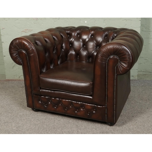 A Thomas Lloyd leather chesterfield club chair