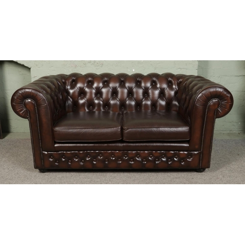 548 - A Thomas Lloyd leather chesterfield club sofa