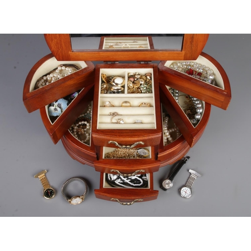 6 - A wooden jewellery box of contents of mostly costume jewellery to include dress rings, brooches, cli... 